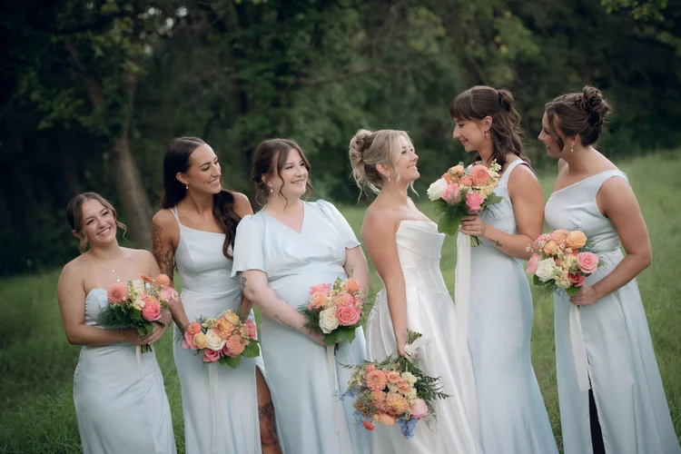 Bride and bridesmaids with pastel bouquets