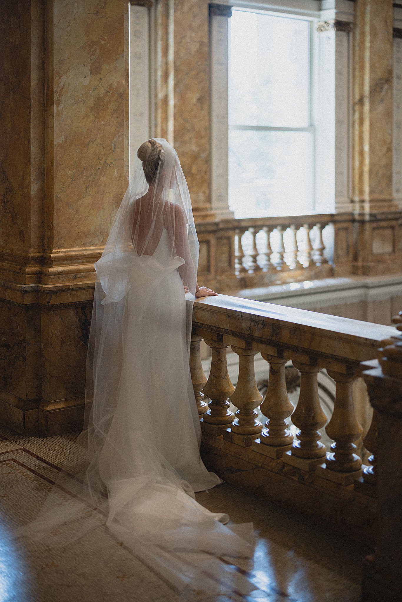 Bride in a grand historic interior with elegant architectural details