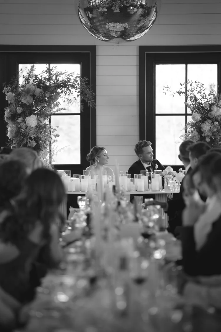 Bride and groom during wedding speeches