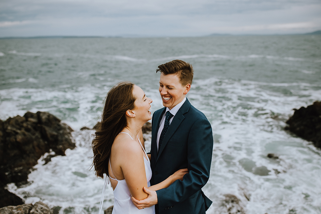 Joyful newlyweds photographed beside the Irish coast