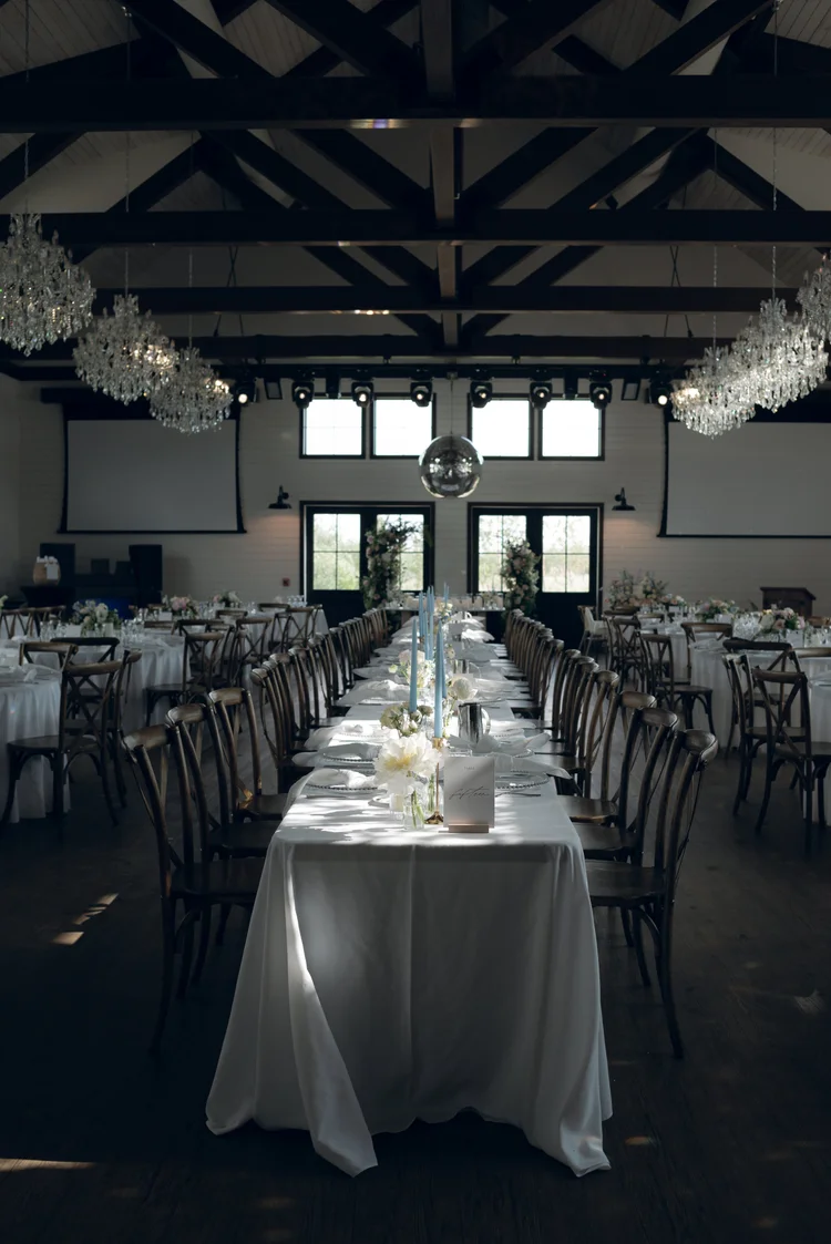 Luxury wedding reception hall with chandeliers and elegant tables