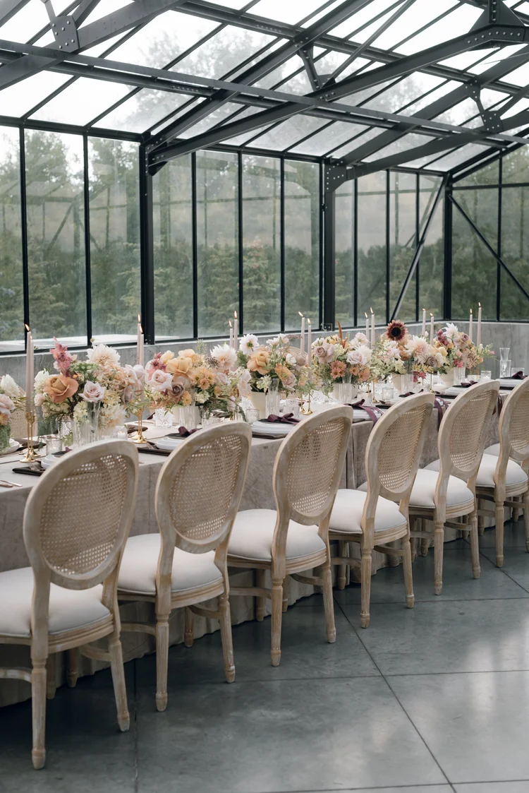Elegant glasshouse reception with florals
