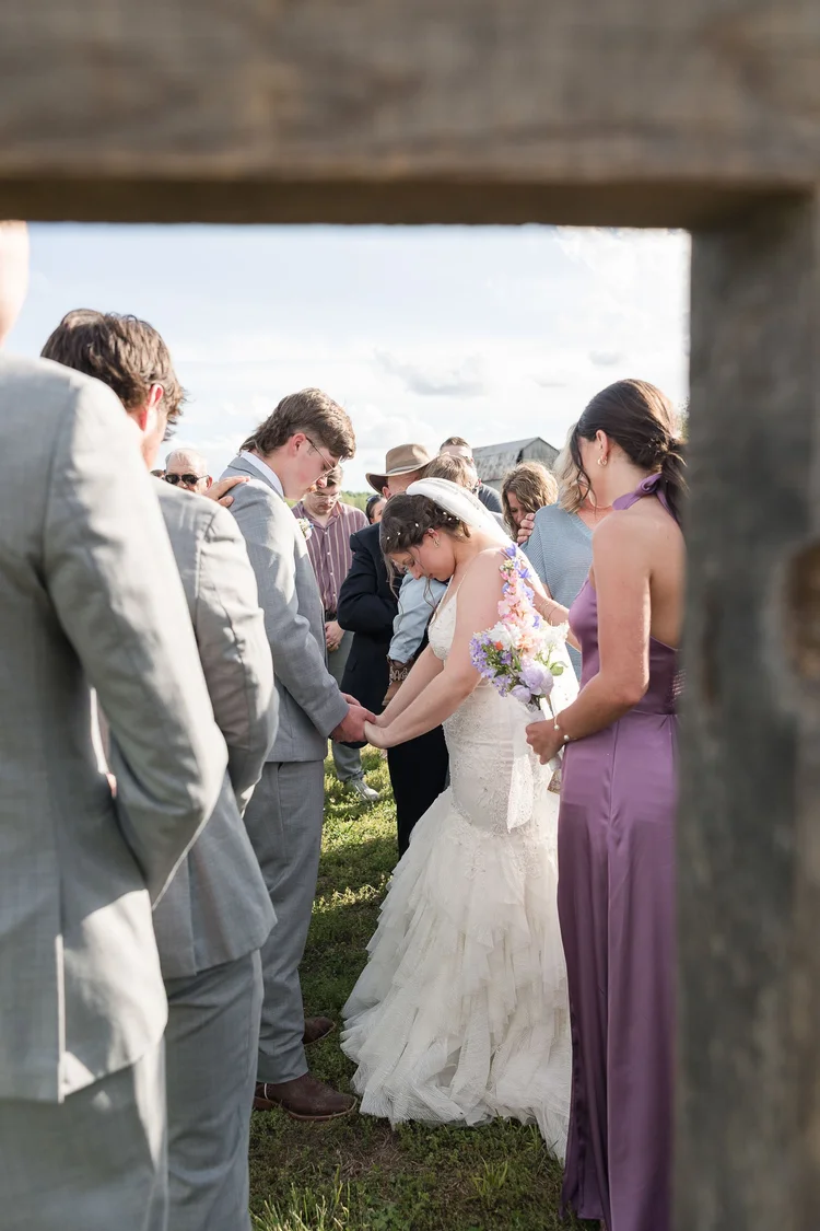 Bride and groom holding hands during an outdoor wedding ceremony in Ireland