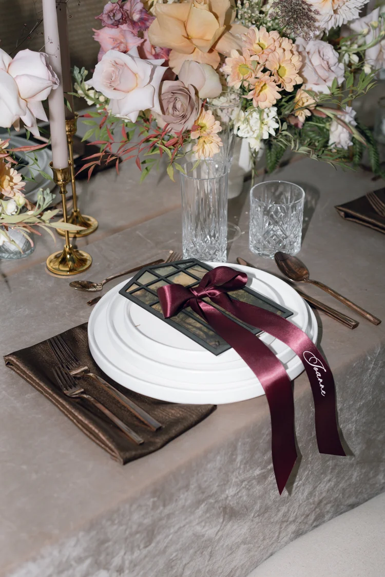Luxury wedding table detail with ribbon and flowers