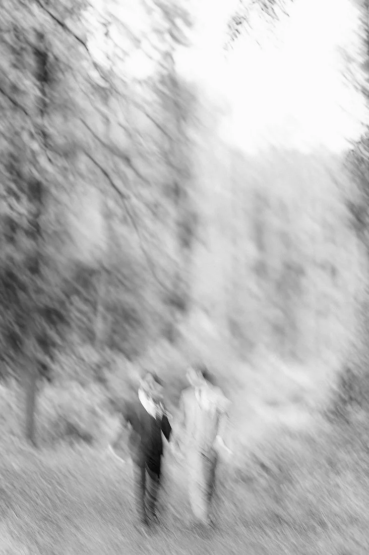 Artistic black and white wedding portrait with intentional motion blur