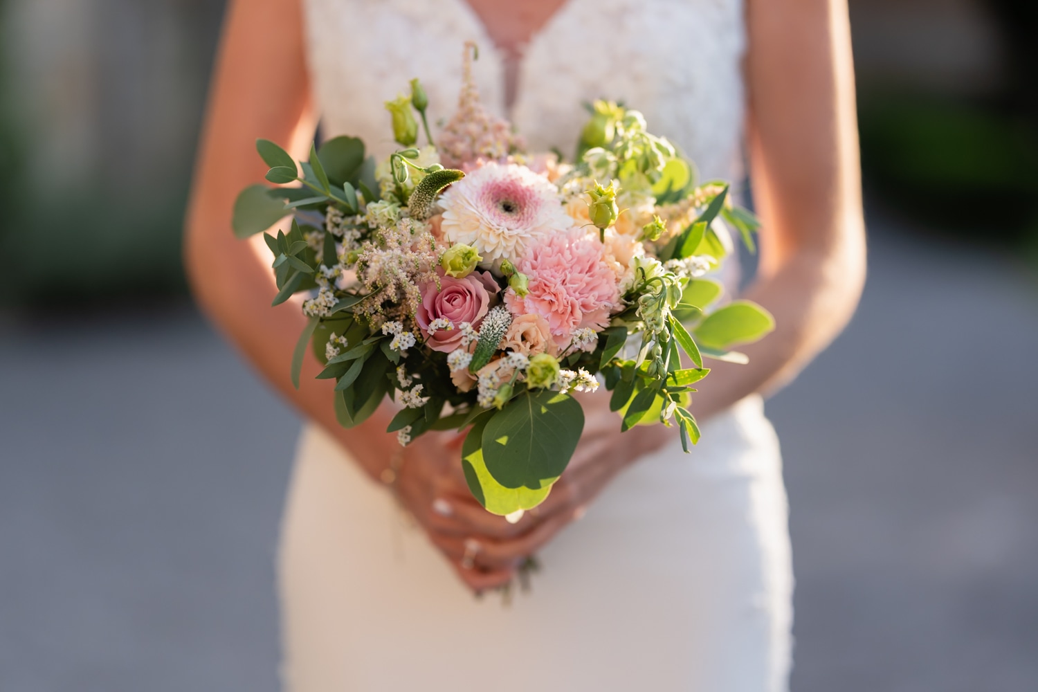 Smiling bride embracing the groom