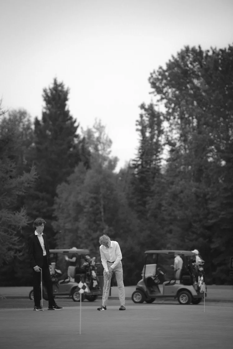 Wedding guests playing golf during a relaxed celebration