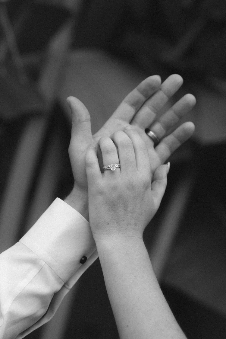 Wedding rings on a couple's hands